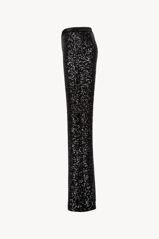 Pantalon droit avec taille en velours élastique, zip caché et fentes latérales.