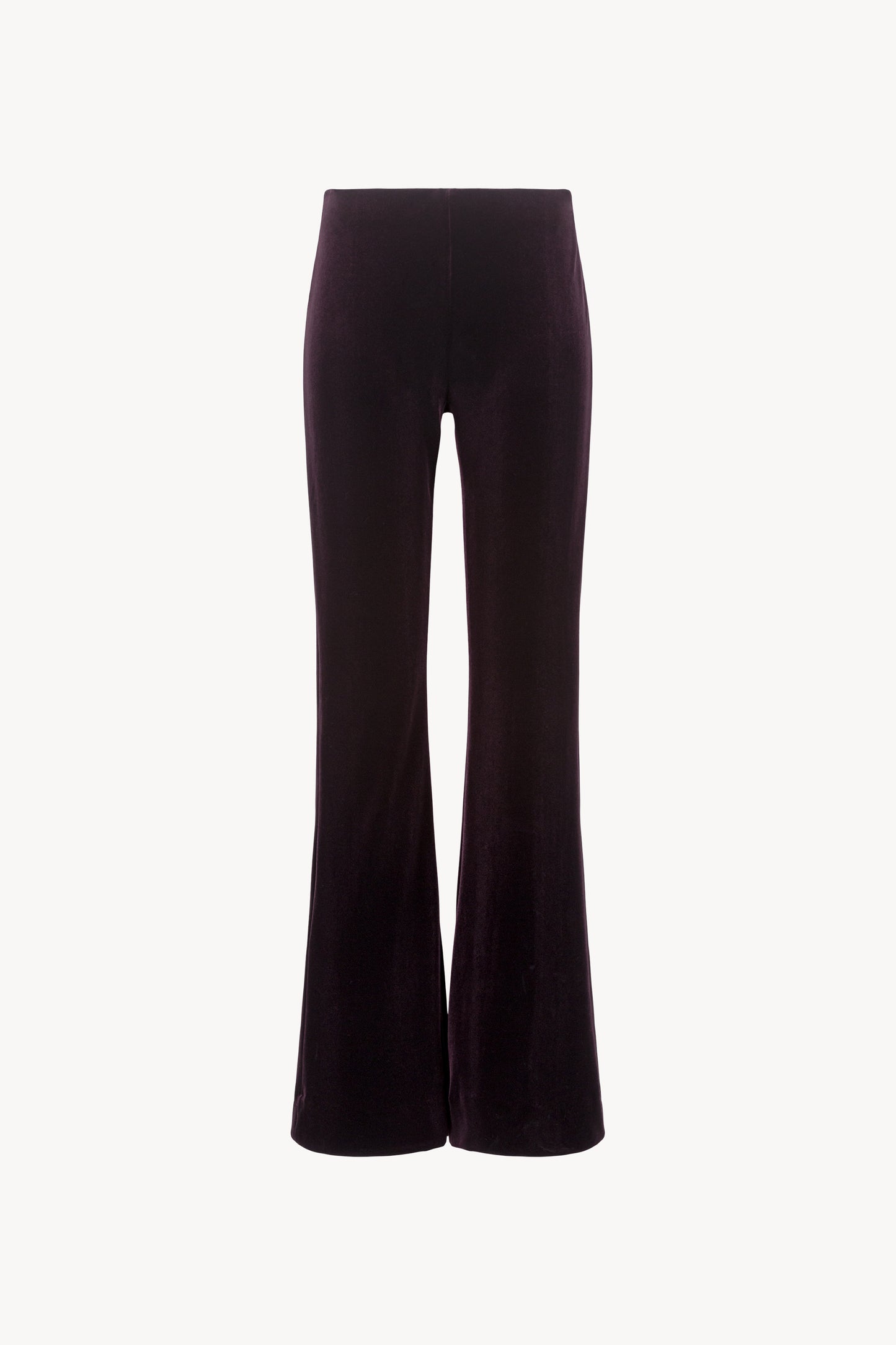 Pantalon évasé en velours extensible. Ceinture élastique cachée. Fermeture à glissière côté.