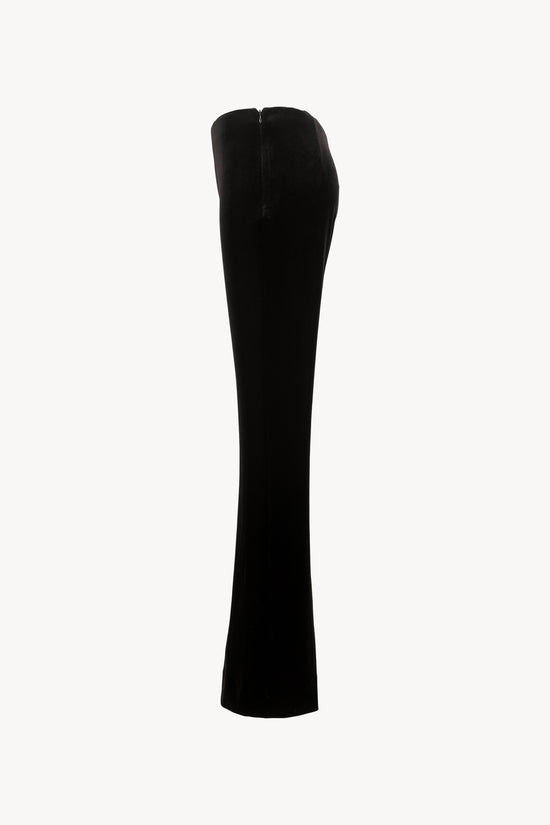 Coupe évasée, ceinture élastique invisible, zip discret sur le côté.