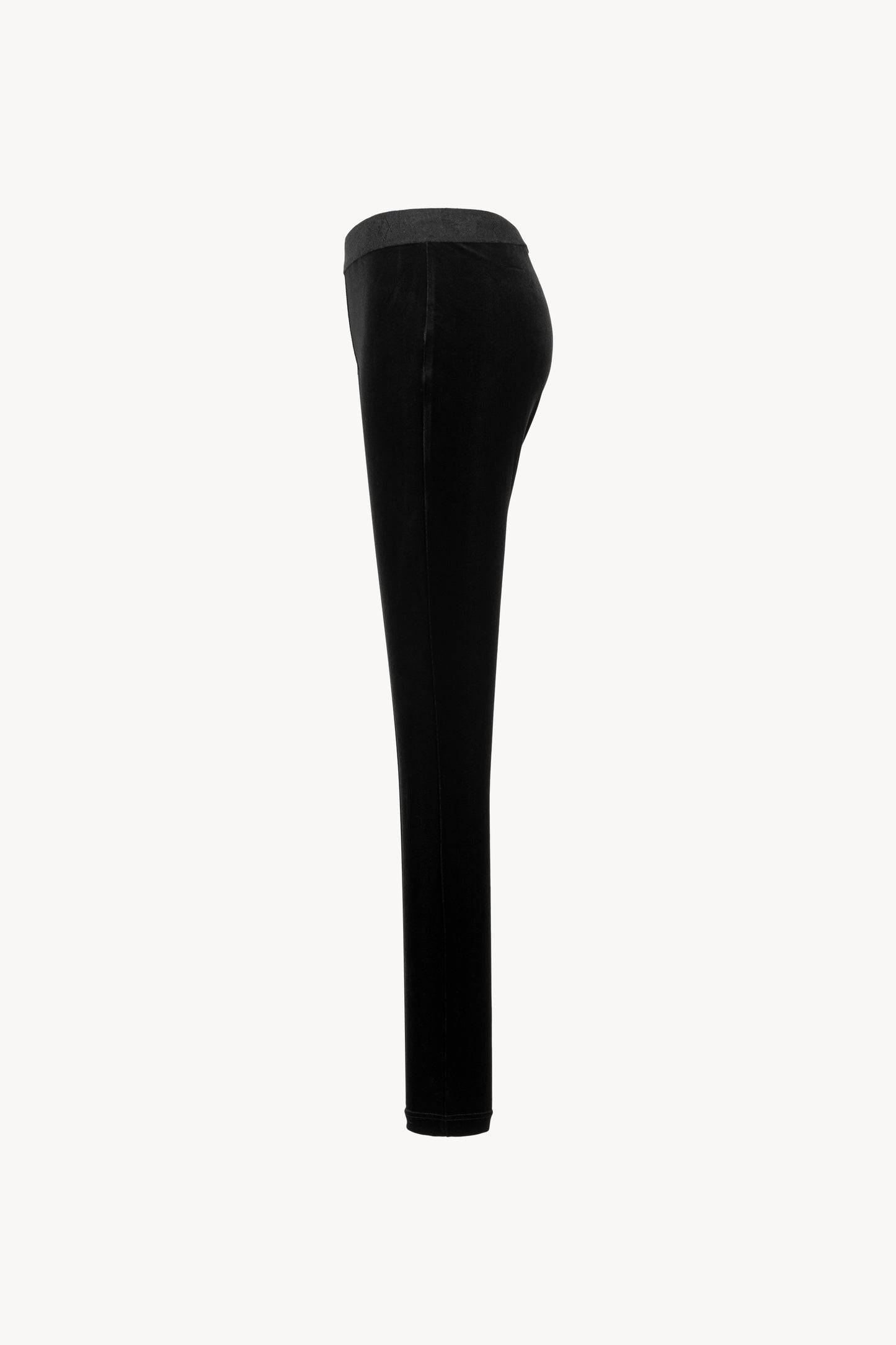Legging en velours souple. Taille élastique, coupe moulante. Zip discret sur le côté.
