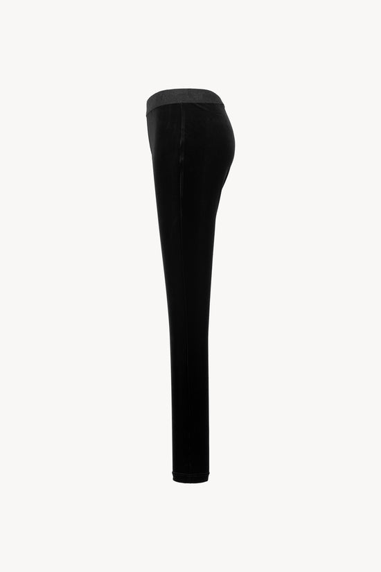 Legging en velours souple. Taille élastique, coupe moulante. Zip discret sur le côté.