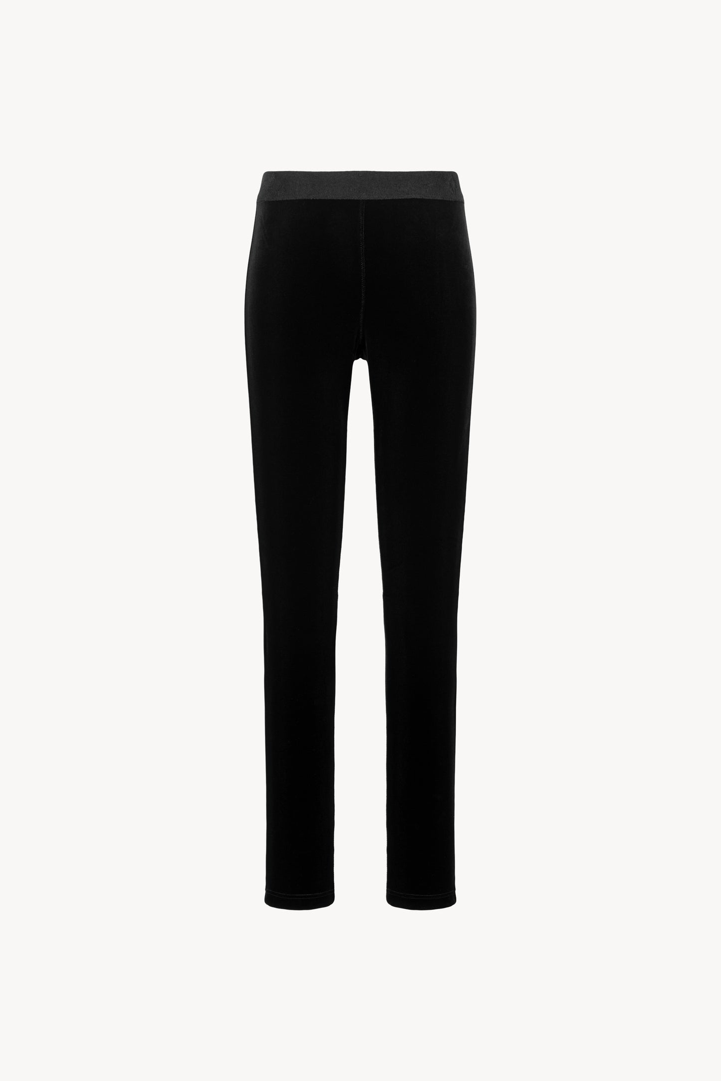 Pantalon en velours extensible noir. Coupe ajustée avec ceinture élastique. Fermeture à glissière latérale.
