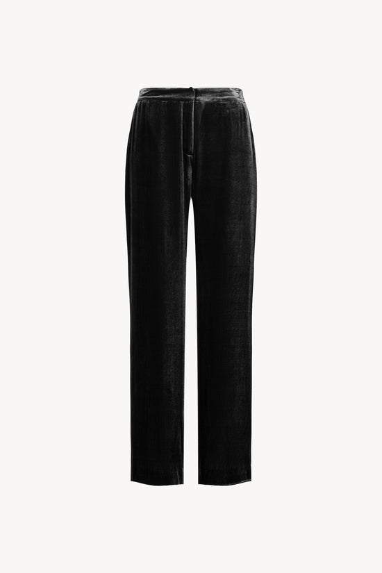 Pantalon large en velours avec poches italiennes et fausses poches passepoilées. Ceinture élastique au dos pour un confort optimal.