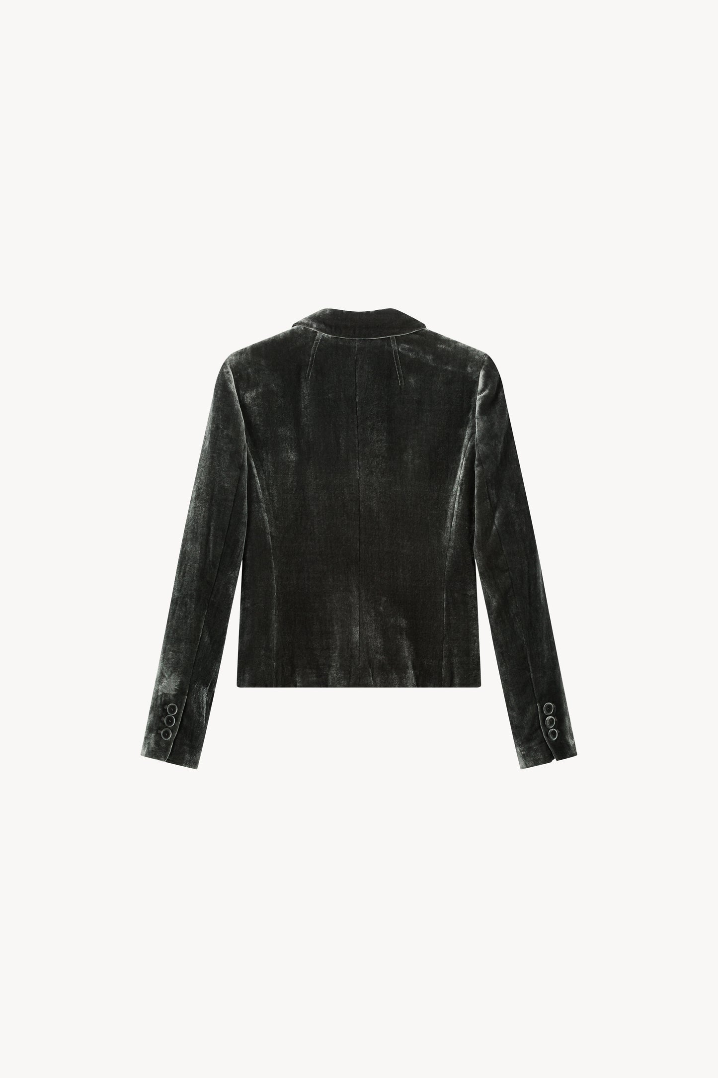 Blazer court en velours. Col tailleur, deux boutons à l'avant. Détails de poches passepoilées et six boutons sur les manches.