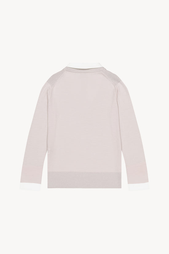 Pull beige a coupe droite et col chemise contrasté en popeline. Lurex discret sur col et épaules. Ouvertures latérales.