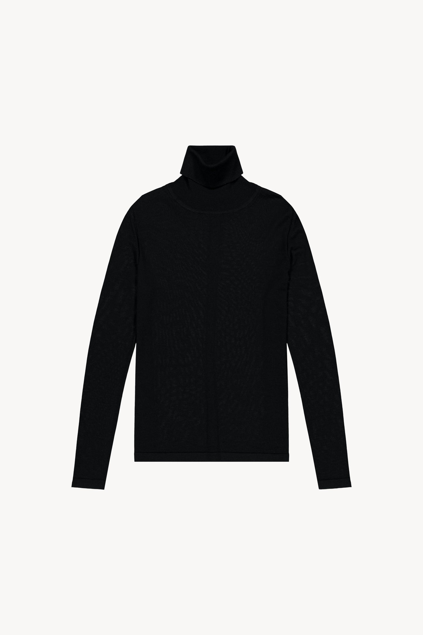 Pull en maille fine laine mérinos. Col roulé, manches longues, jeu de maille structuré au dos.
