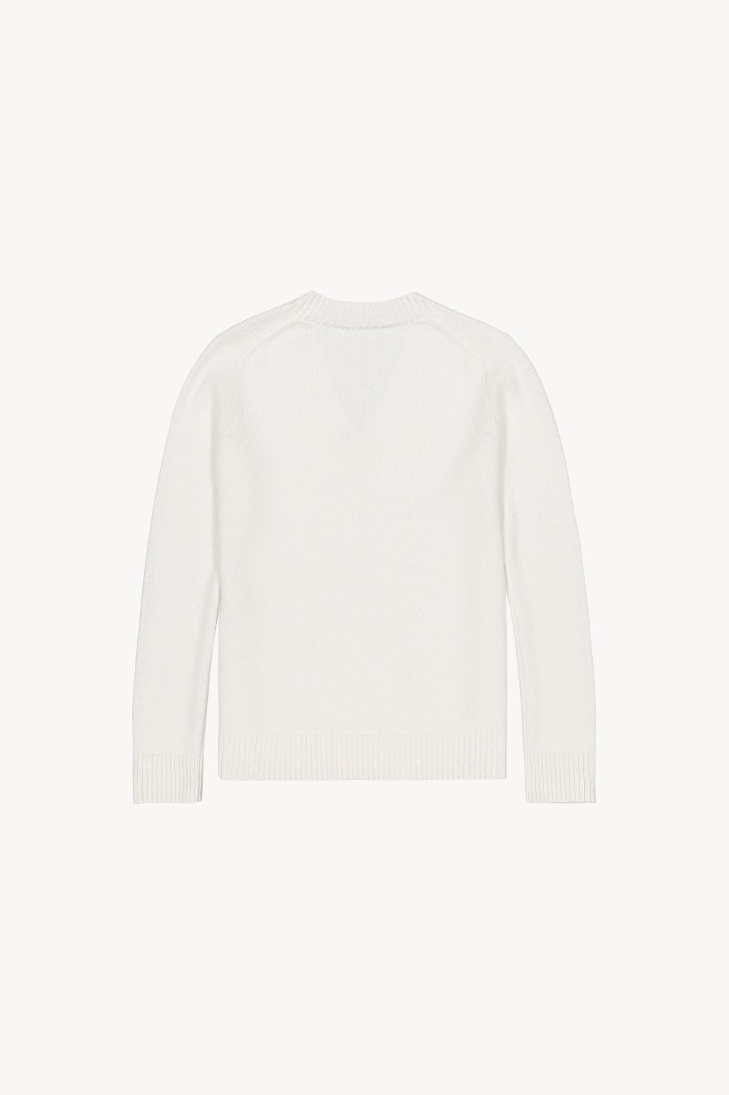 Ce pull col V blanc cassé ,les détails sur le col, les poignets et le bas du pull. 