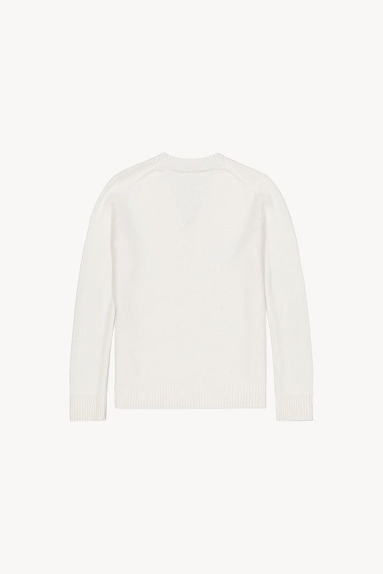 Ce pull col V blanc cassé ,les détails sur le col, les poignets et le bas du pull. 