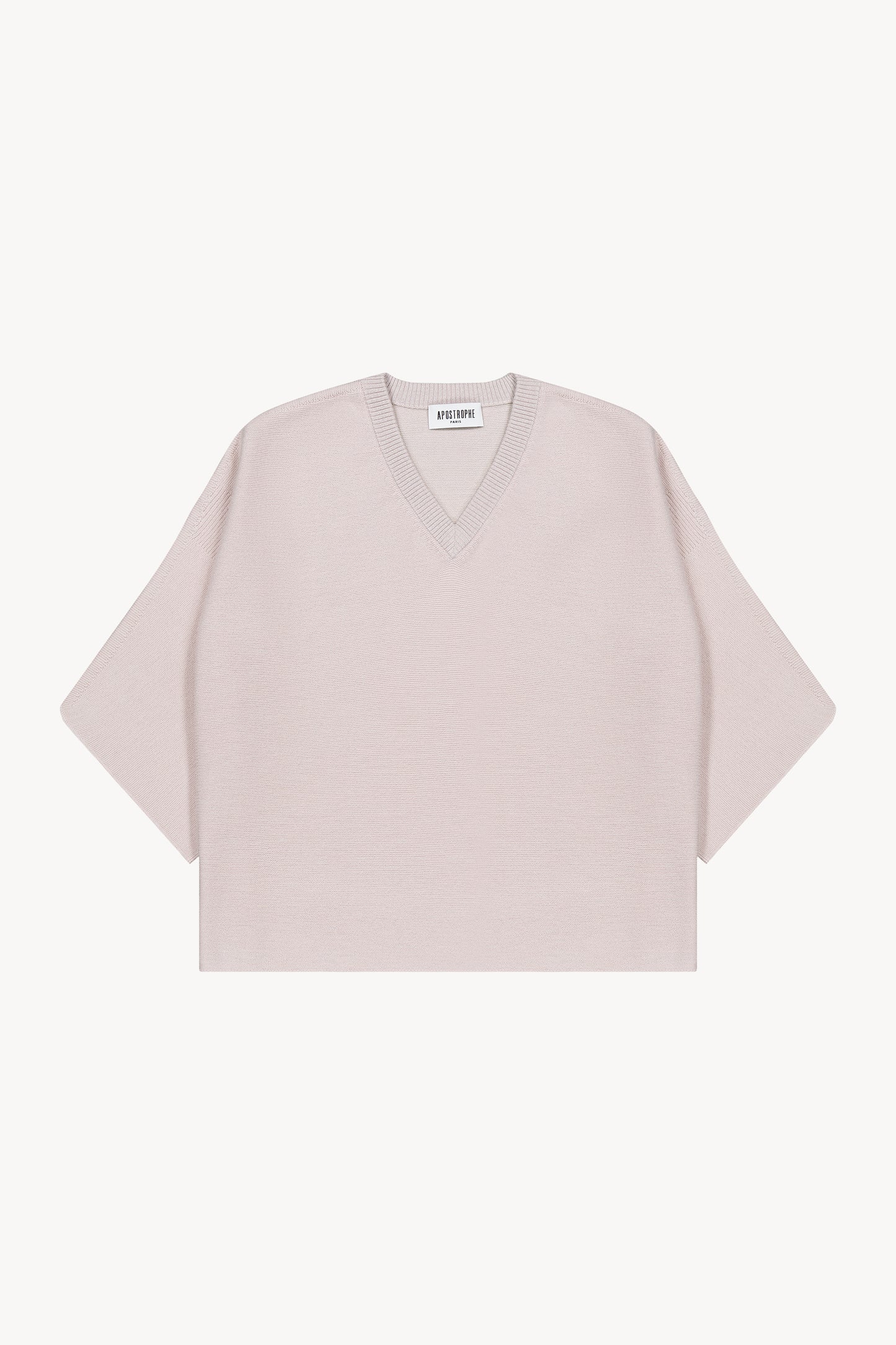 Pull oversize en laine. Col V en maille lurex. Manches 3/4. Finitions côtelées. Fentes latérales.