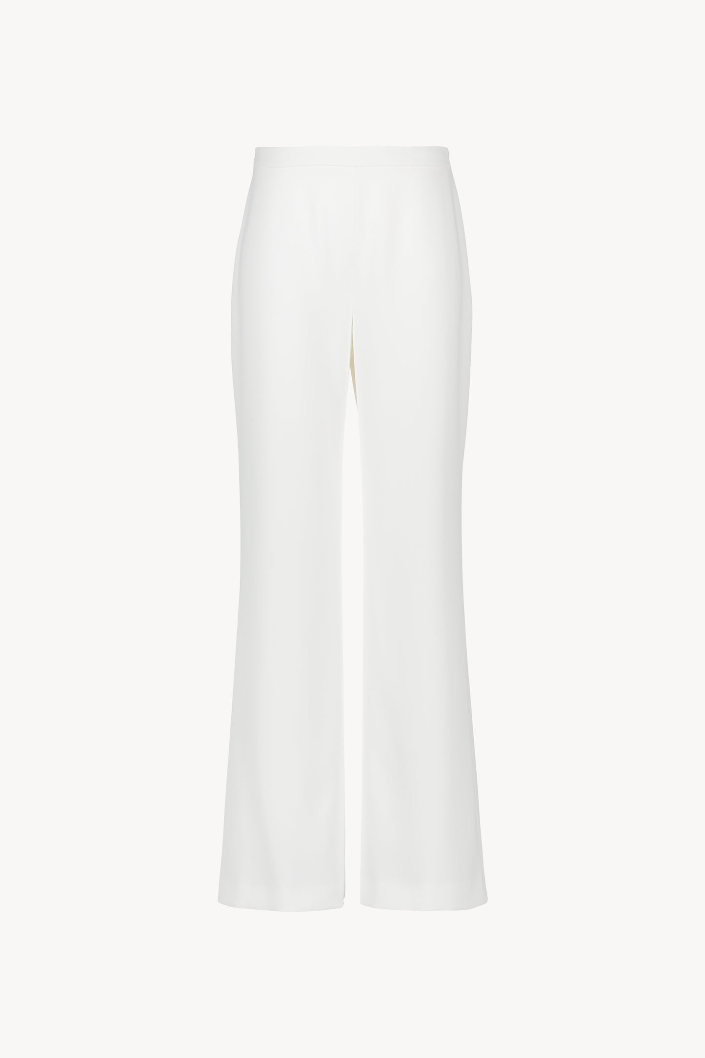 Pantalon taille haute à coupe évasée. Fermeture zippée invisible. Tissu fluide au tomber net.
