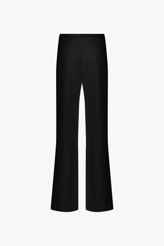 pantalon noir . Coupe évasée. Zip latéral invisible. Tissu léger