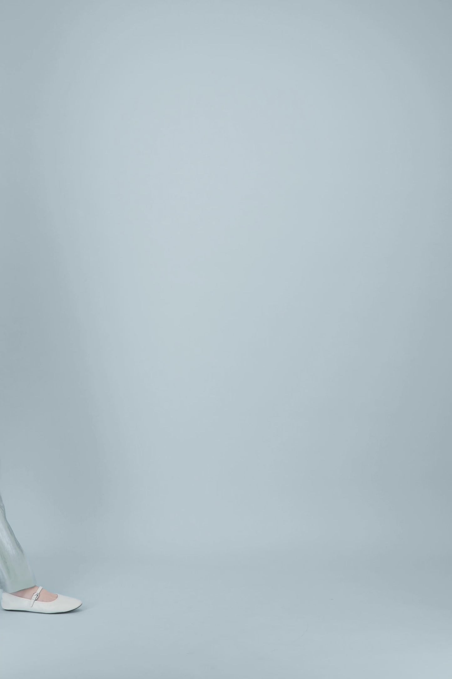 Top femme vert sauge à coupe droite et texture subtile pour un porté léger.