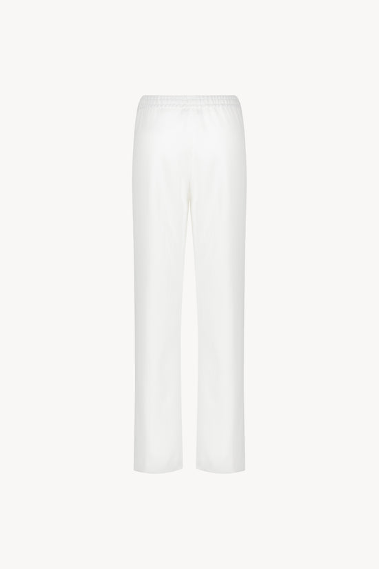 Pantalon fluide large blanc cassé avec cordons réglables avec embouts métal gravés
