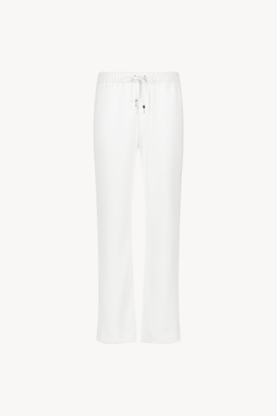 Pantalon fluide large blanc cassé avec ceinture froncée et cordons réglables avec embouts métal gravés
