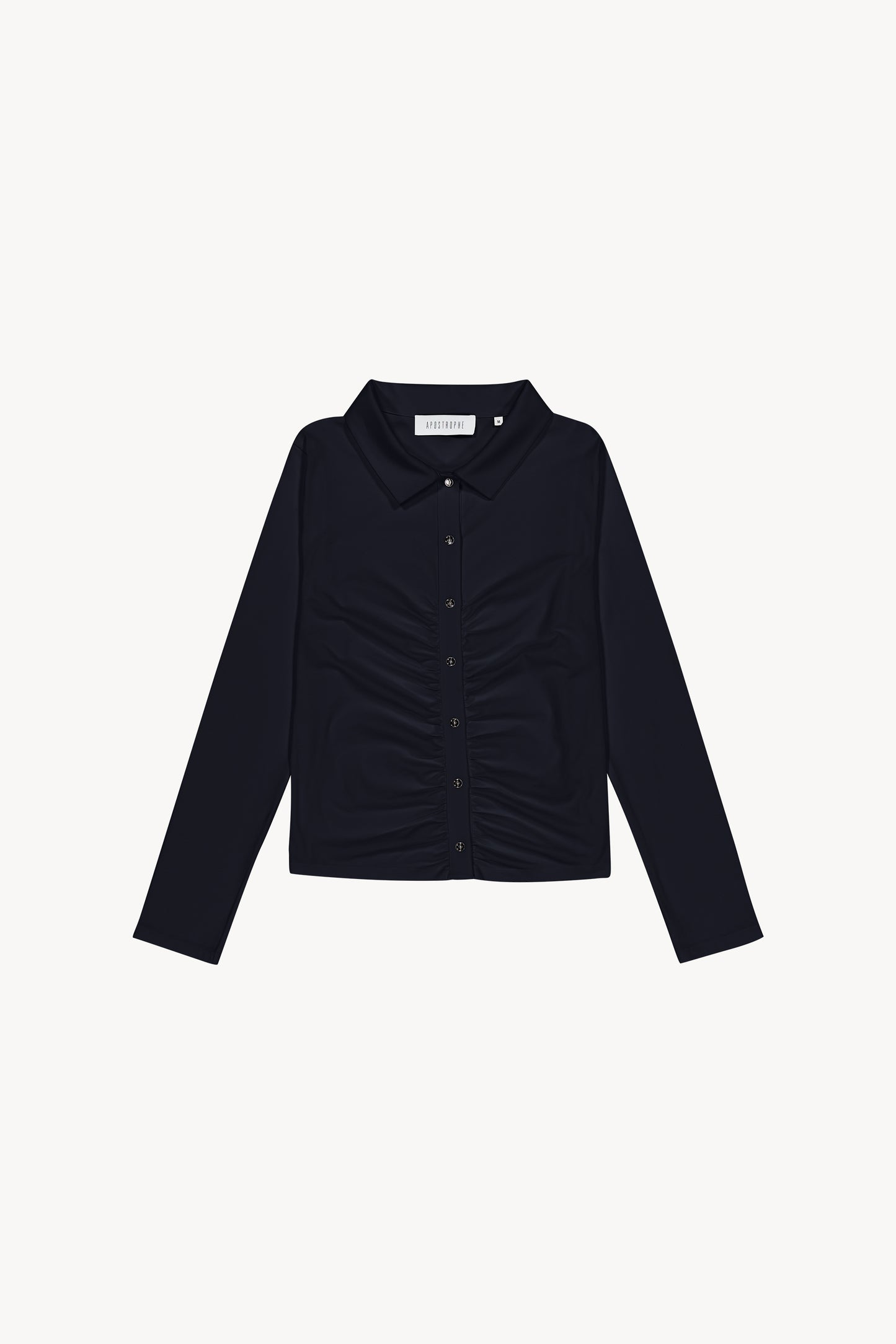 Chemise t-shirt marine dotée d'un détail froncé sur le milieu du vêtement, d'un col chemise, de patte de boutonnage apparente, de boutons métalliques et d'une pièces gravées en métal dans le dos.