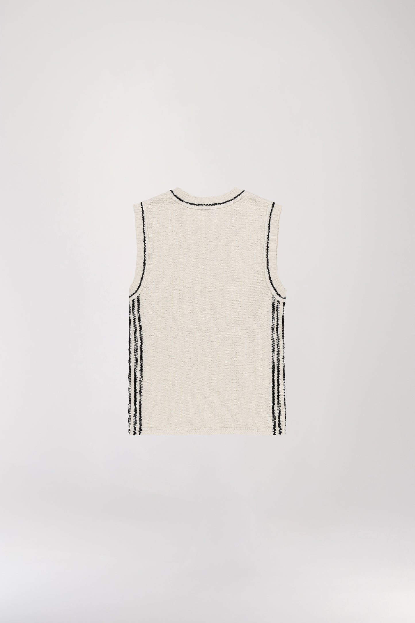 White sleeveless knit top