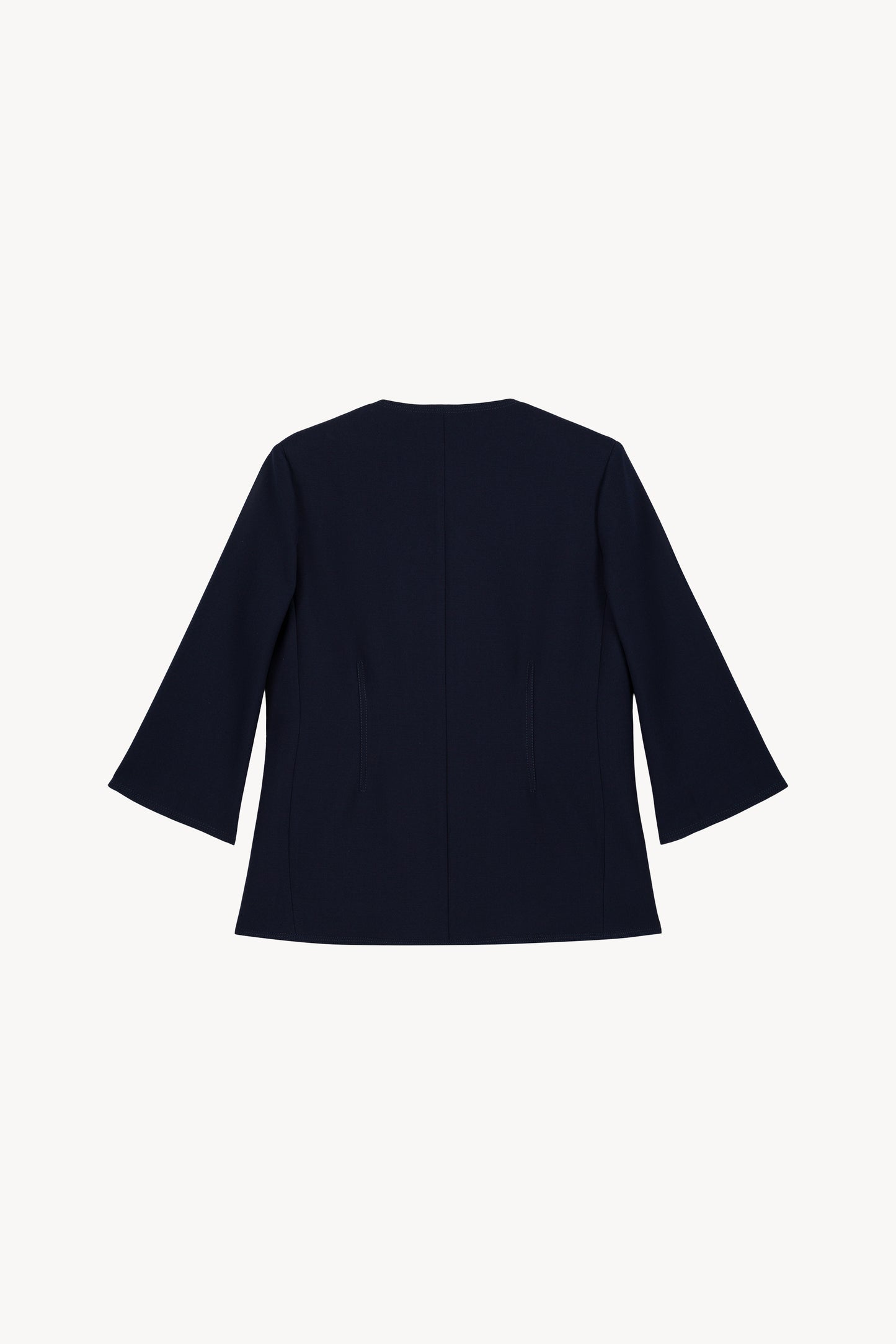 Veste bleu marine chic à manches 3/4 et boutons œillet métallisés.