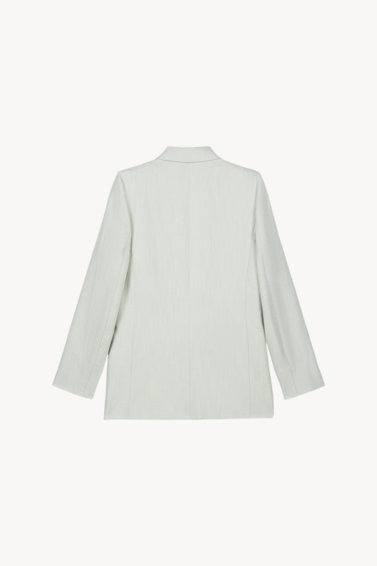 Une veste tailleur vert d'eau en lin-viscose, coupée avec soin, dotée de boutons ton sur ton et de poches passepoil, parfaite pour un style élégant et pratique.