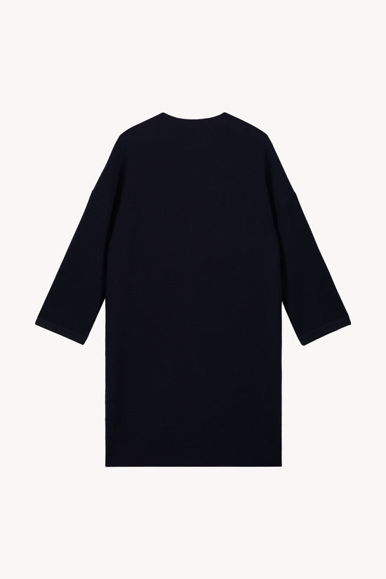 Manteau bi-matière marine, conçu avec des détails en daim et un col drapé fluide