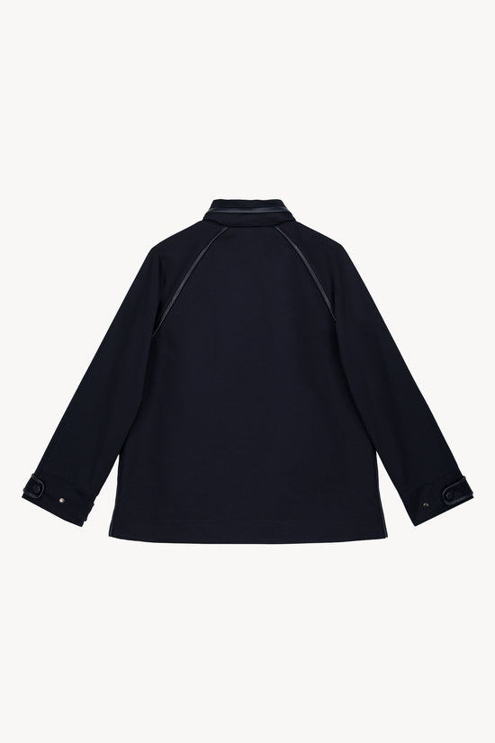 Trench coupe droite marine, à capuche, avec cordon ajustable et finitions utilitaires  pour un look chic.