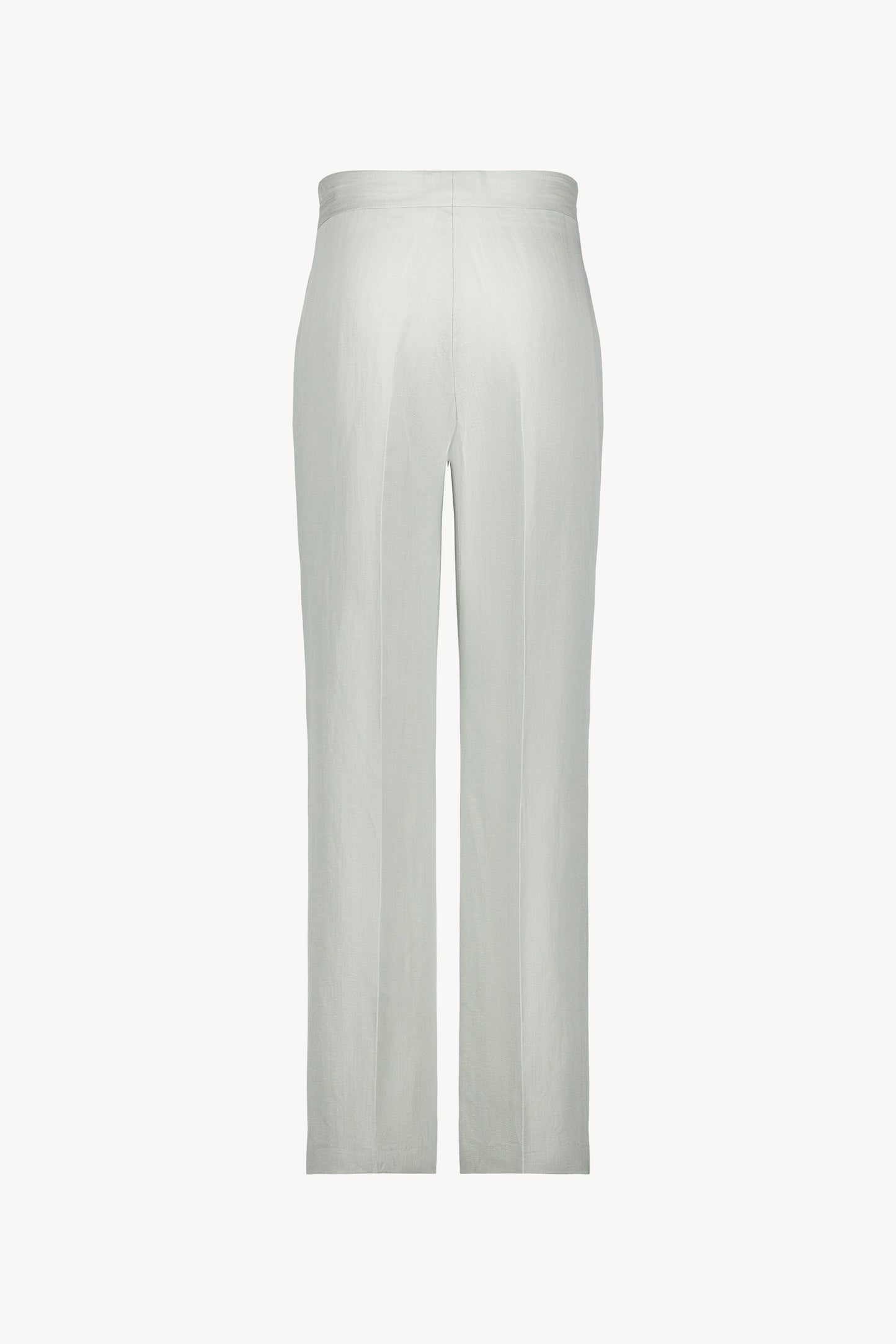 Élégant pantalon de tailleur en lin vert d'eau, avec plis de presse et coupe droite.