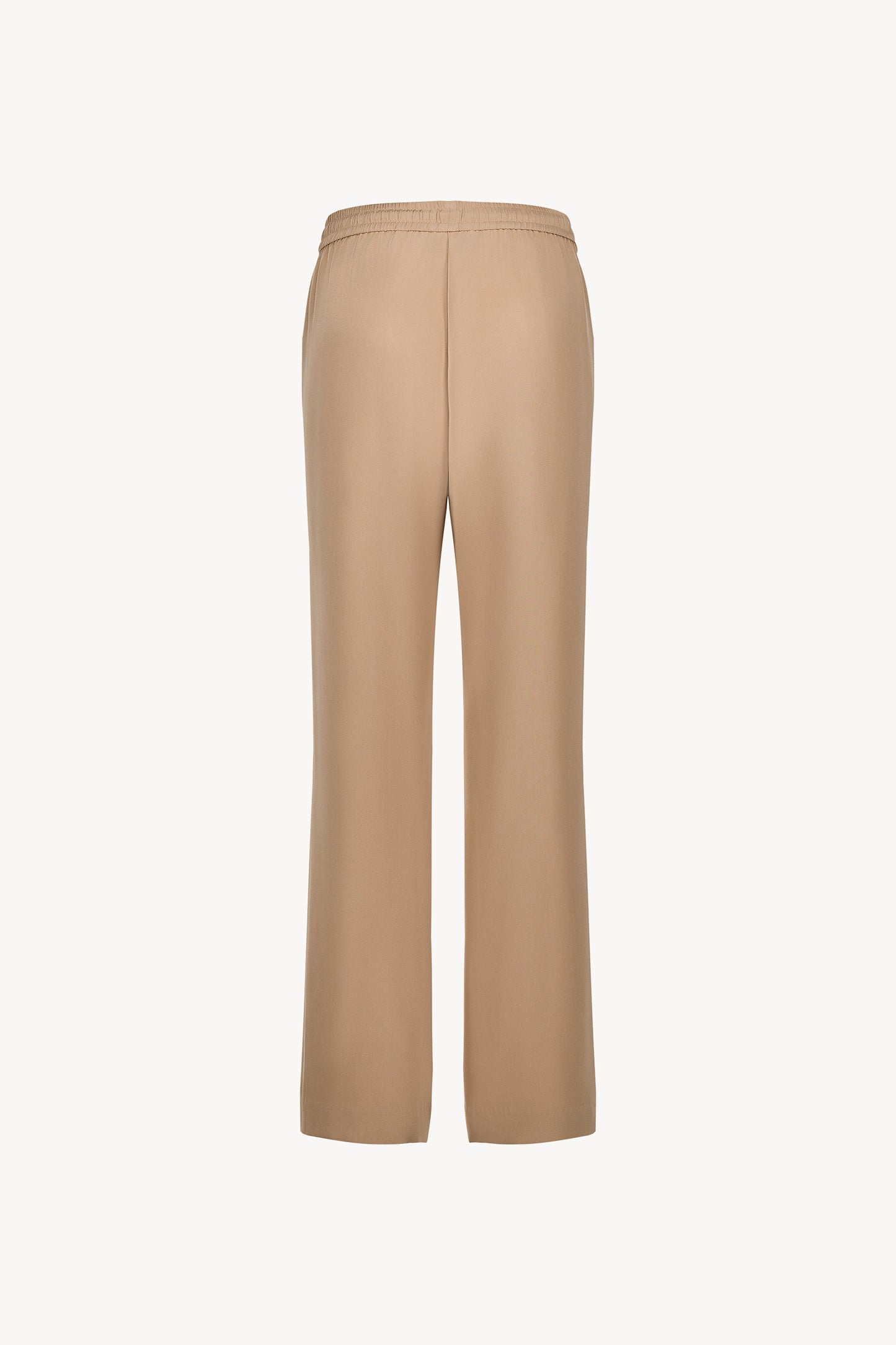 Avec sa taille ajustable et  sa coupe droite , ce pantalon en soie fluide sublime la silhouette .
