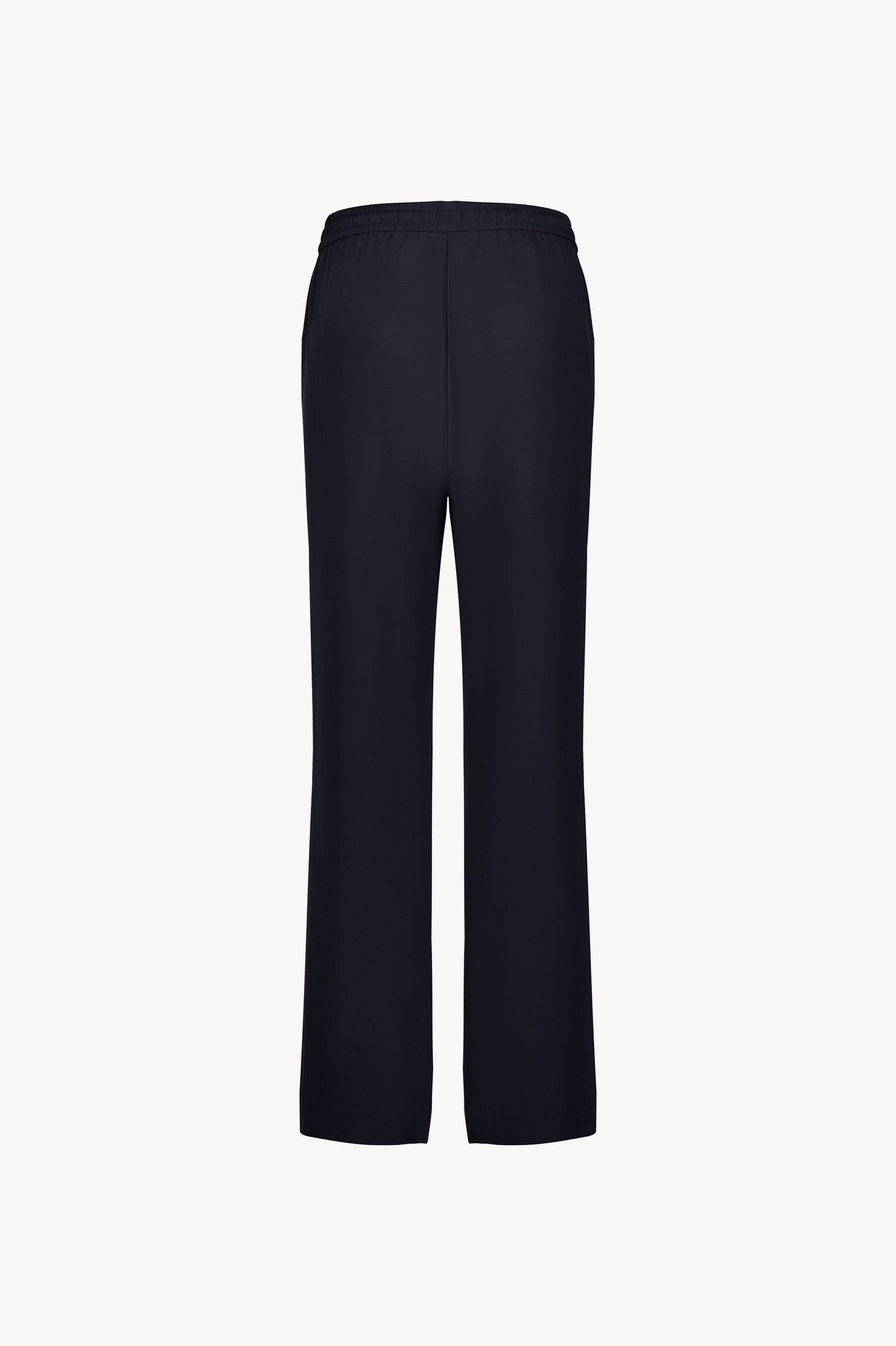 Pantalon en soie Apostrophe marine avec coupe droite et cordon ajustable, une silhouette chic et fluide.