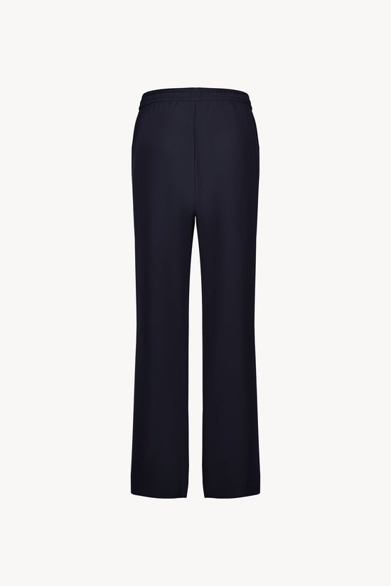 Pantalon en soie Apostrophe marine avec coupe droite et cordon ajustable, une silhouette chic et fluide.