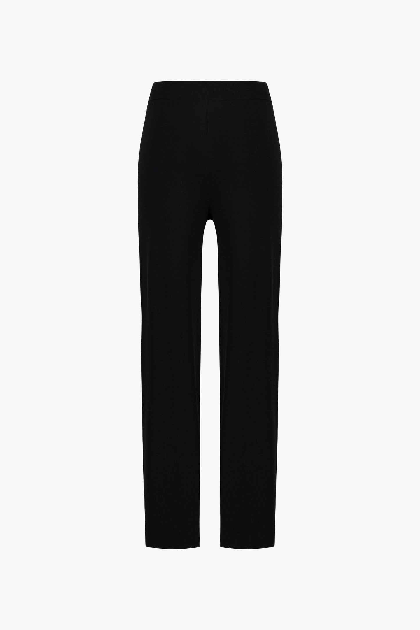 Pantalon marine en maille. Taille élastique et coupe fluide.
