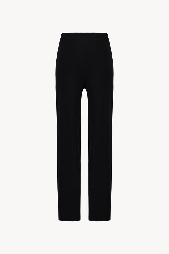Pantalon marine en maille. Taille élastique et coupe fluide.
