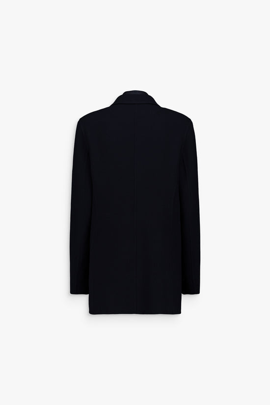 Blazer-chemise bleu marine, finitions soignées et look harmonieux.