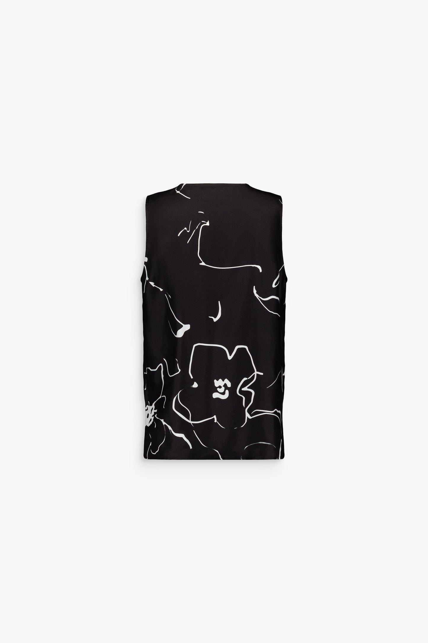 Haut noir fluide, orné de fleurs raffinées avec fentes latérales.