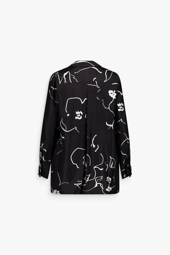 Chemise femme noire, élégance et légèreté avec patte de boutonnage discrète.